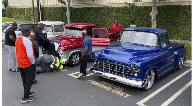 Vintage trucks participating in a 22-year road trip tradition